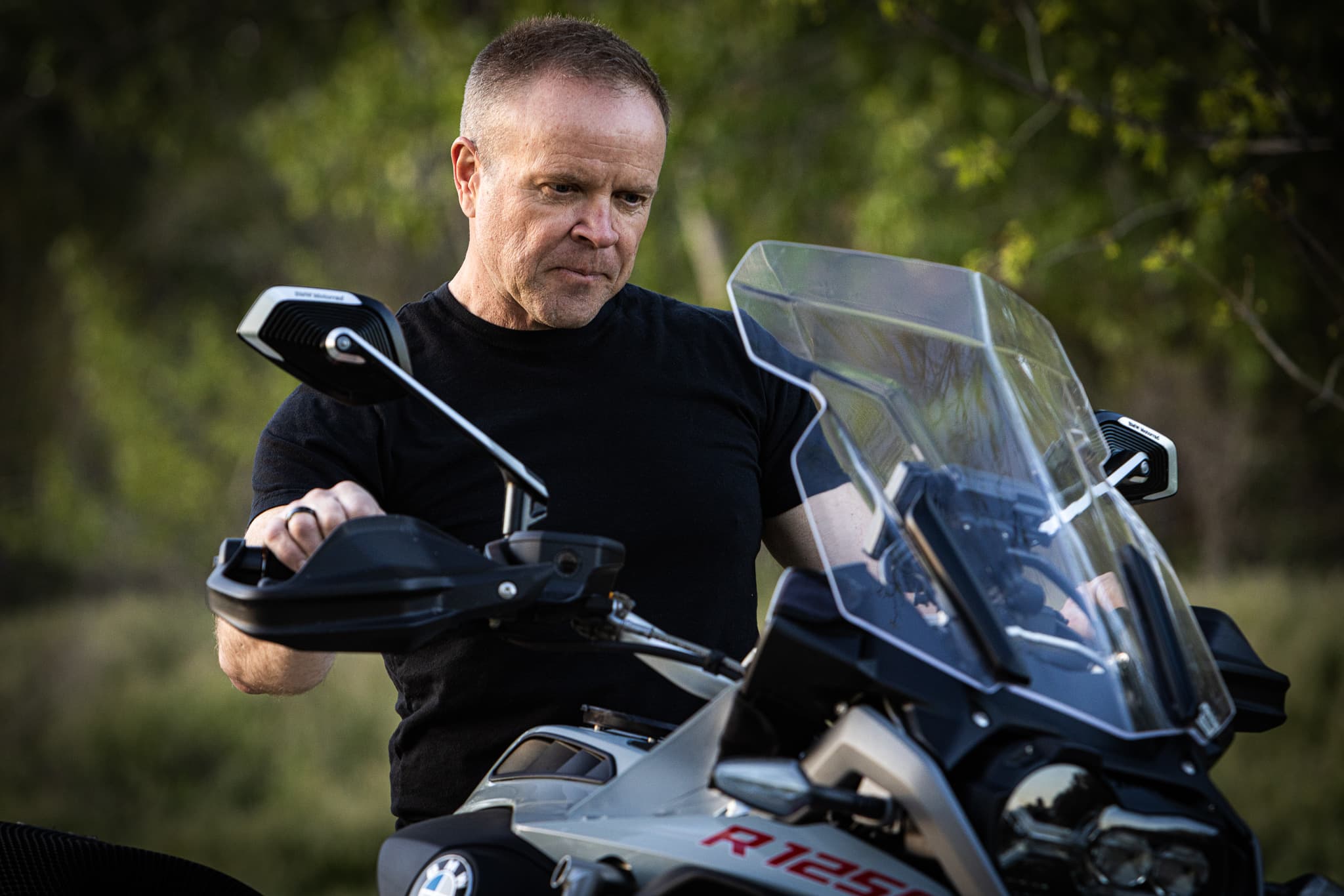 Dale Dixon with his adventure motorcycle outdoors