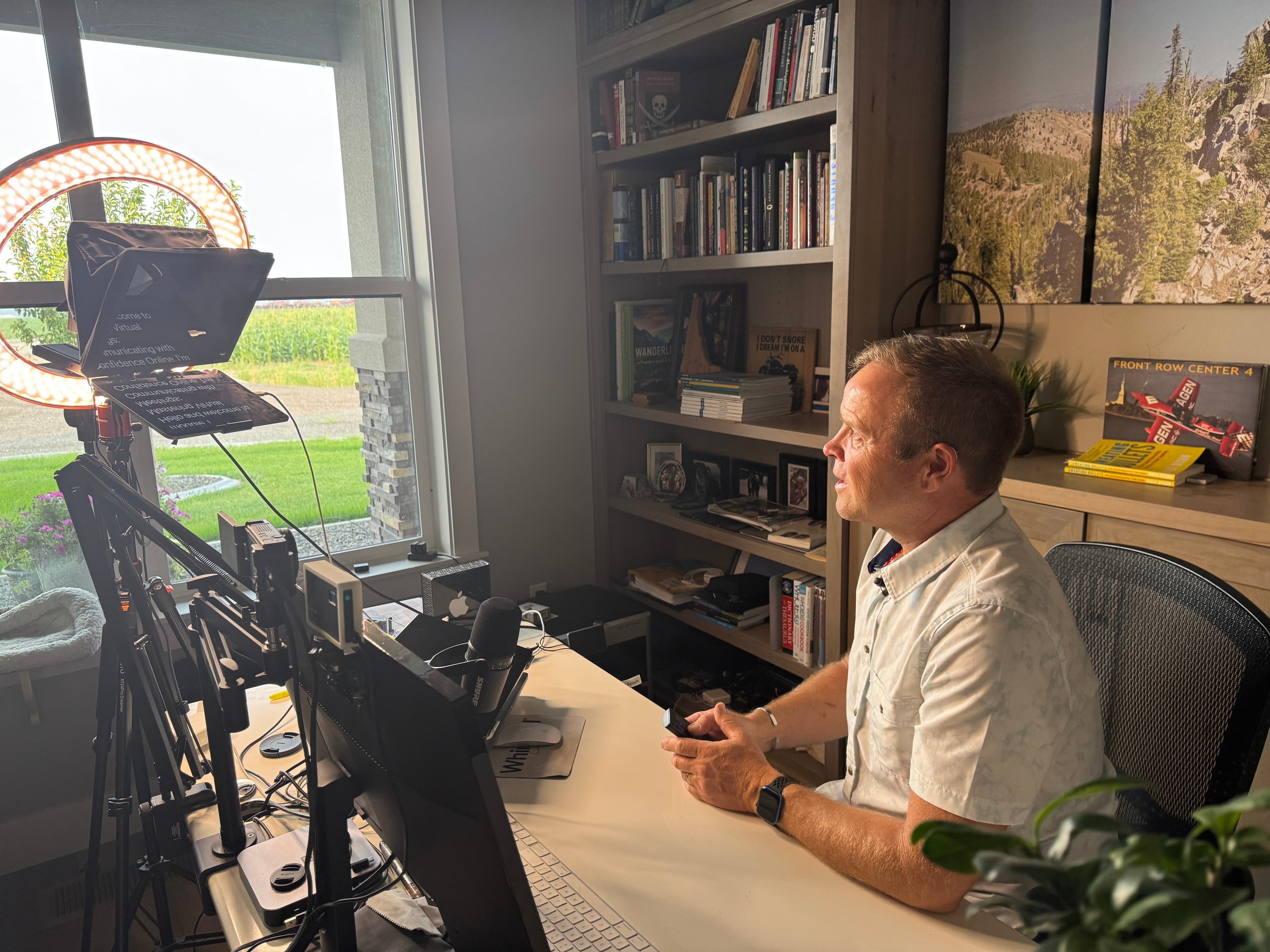 Dale Dixon coaching an on-camera presentation from a desk setup