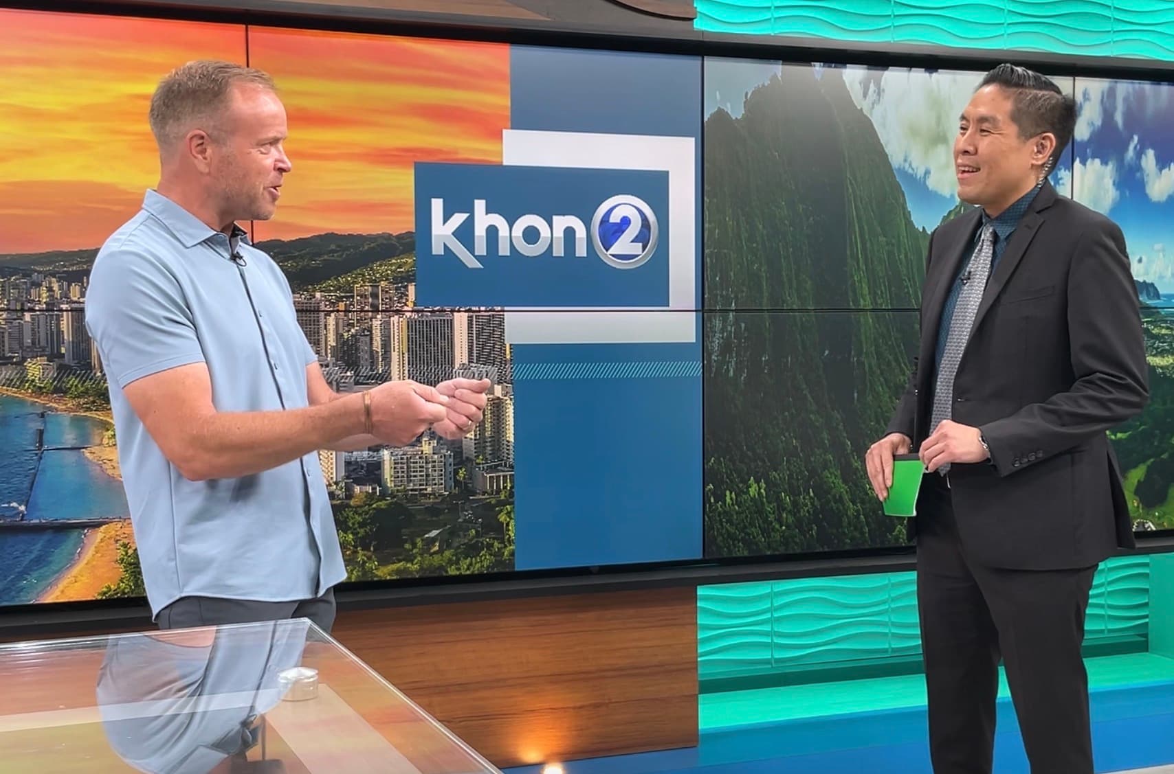 Dale Dixon speaking with a television anchor in the KHON2 studio